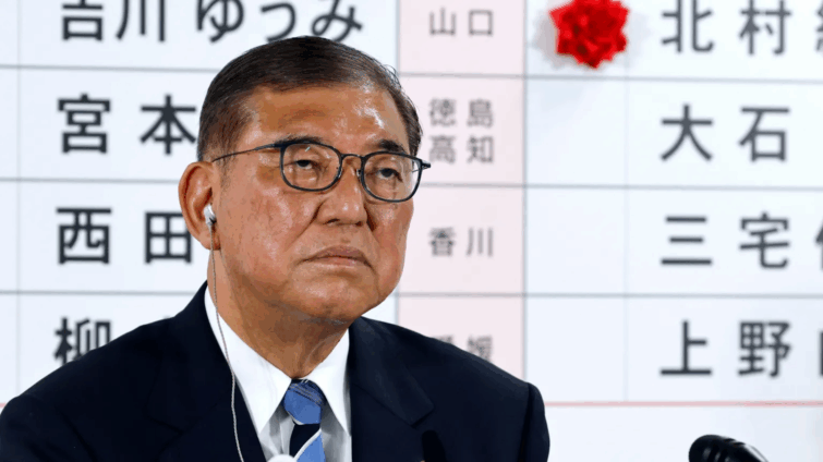 Japan’s PM vows to stay on despite bruising election loss